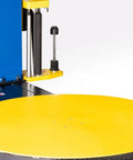 Close-up of Heavy Duty Semi Auto Pallet Wrapper With Built In Digital Scale, featuring yellow rotating platform for 5000 lb loads.