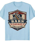 Classic Retro Mechanical Engineer Tee With Vintage Barn Garage Gear Badge Design For Hands-On Builders And Tool Loving Tinkerers In 100 Cotton on blue background.
