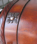 Close-up of a wooden surface featuring a vintage iron decorative tack, part of the 50 Pack Vintage Upholstery Nails Heavy Duty Iron Decorative Tacks For Furniture Makeover Rust Resistant Plated Surface Dead Simple Install Solid Grip Top Tier Craft Gear No Hassle Assembly.