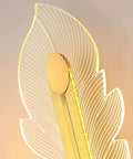 Hella Smooth Game Changing Geometric LED Wall Sconce With Dope Phoenix Tail Design and Acrylic Shade close-up view with light.