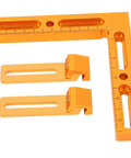 Workhorse Aluminum Alloy Vise Clamps Compatible With T Slot And Perforated Worktables holding measurement square with two clamps.