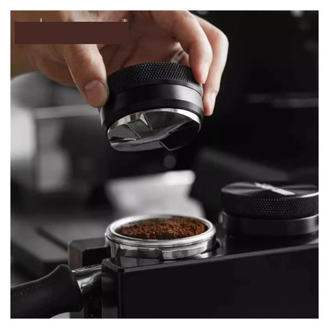 Hand holding Adjustable Height Espresso Coffee Distributor Tool for evenly leveling coffee grounds in portafilter.