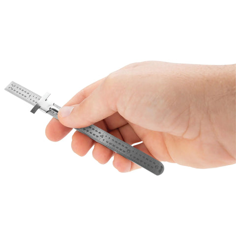 Hand holding Six Inch Stainless Steel Sliding Depth Gauge With Ultra Fine 64T Graduations For Precise Depth And Step Measurements Machined Ruler Quality Tool For DIY And Pro Grade Use