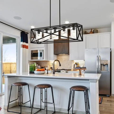 Boss Level Farmhouse Linear Chandelier With Textured Seedy Glass Shades installed over a modern kitchen island