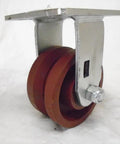 Built Tough Heavy Duty Swivel And Rigid Caster Set Featuring 4 Inch By 2 Inch Ductile Steel Wheels Kingpinless Design showing a close-up of a swivel caster wheel.