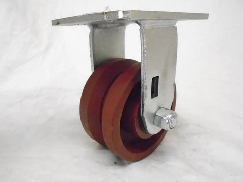 Built Tough Heavy Duty Swivel And Rigid Caster Set Featuring 4 Inch By 2 Inch Ductile Steel Wheels Kingpinless Design showing a close-up of a swivel caster wheel.