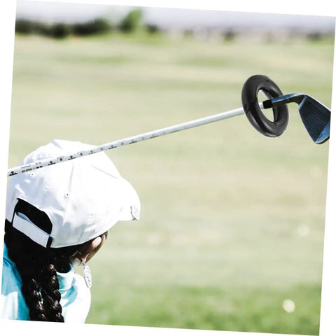 Golfer practicing with Weighted Golf Swing Ring For Beginners And Pros, Practice Gear To Stabilize Your Swing, Boost Swing Weight And Power