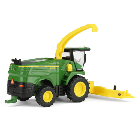 One Sixty Fourth Scale Farm Harvester Toy With Swiveling Spout Metal Frame And Body Plastic Forage Head Rear Hitch Realistic Five Inch Length Model For Kids Three And Up image showing side view with raised spout