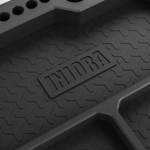 Close-up of the Silicone Tool Tray Organizer With Magnetic Holders And Stand, Heat Resistant Parts Tray For Workshop surface texture.