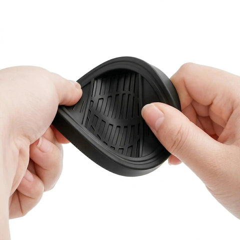 Hands holding flexible rubber 8 Pack Furniture Caster Cups With Rubber Bed Stoppers For All Furniture Wheels, Chair Coasters And Floor Protectors
