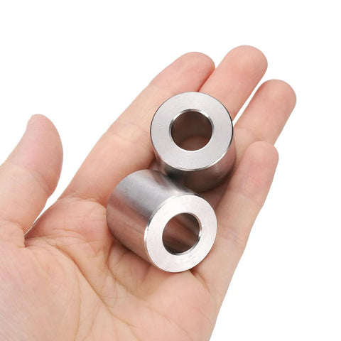 Rock Solid 304 Stainless Steel Spacers Set Of Two Hella Tough Heavy Duty Precision Bushings For M12 Screws in hand.