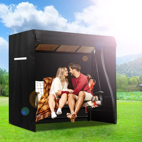 Couple sitting on a swing with All Weather Outdoor Swing Cover For A 3 Seat Triple Seater Patio Hammock And Glider Chairs.