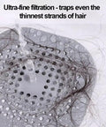 Ultra-fine filtration of Two Pack Shower Drain Hair Catcher With Strong Suction Cups trapping hair strands in grey design.