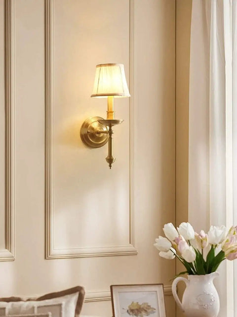 Modern Brass Wall Lamp With White Cotton Drum Shade Matte Warm Antique Finish Easy Install Sconce For Living Room Hallway And Decor Lighting Vibe Ideal For Bedrooms And Dining Areas installed in elegant room