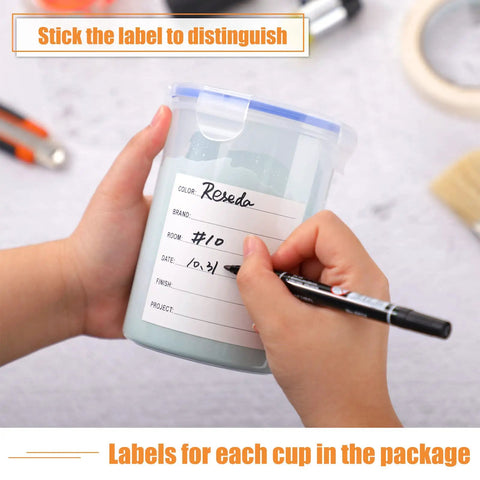 Hand writing on label of Eight 1000ml Paint Containers With Stainless Steel Mixing Balls, Airtight Lids, Labels Included.