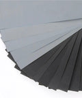Get Fresh 100 Pc Assorted Wet Dry Sanding Sheets Sized At 9x3 8 Inch featuring gray and black smooth surfaces for polishing.