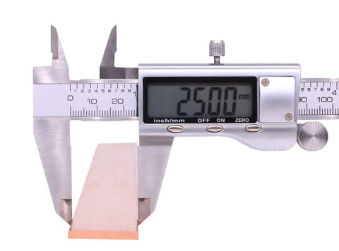 Digital caliper measuring Copper Flat Bar C110 Grade One Eighth Inch Thick By One Inch Wide By Twelve Inch Long Solid Copper Plate Stock