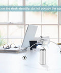 Newton's Cradle Desk Toy Dope Office Decor With Pendulum Motion on a modern office desk with a laptop and glasses