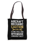 Caution Flying Tools Tote Bag For Aircraft Mechanic And Aviation Tech showing text design on black fabric