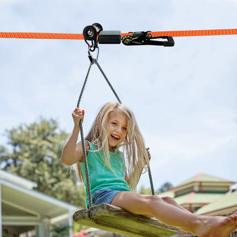 Child enjoying a ride on a backyard zipline with Silicone Zipline Brake Stopper for Slackline and Backyard Zipline Braking System Durable Stopper