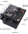 Top Shelf Mini Table Saw And Heavy Duty Portable Craft Station For Wood Cutting Sanding Engraving Drilling All In One Adjustable Desktop Power Tool with safety bezel and aluminum alloy components.