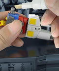 Applying Action Figure Joint Reinforcement Glue Pen For Model Kits Toy Repair Adhesive Quick Cure Formula to stabilize limbs.
