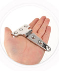 Heavy Hitter T Shaped Barn Door Hardware Stainless Steel Pivot Hinge held in hand, showcasing its robust design and mounting holes.
