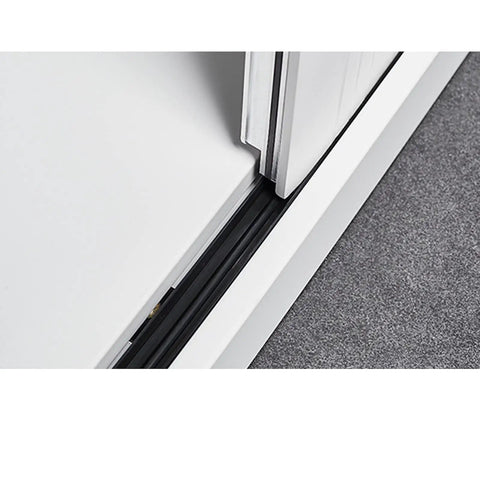 Sliding door mechanism of metal filing cabinet with key lock, featuring four shelves for home office document storage.