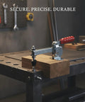 Badass Heavy Duty Iron Toggle Clamp For Woodworking Jigs And Welding Fixtures attached to a wooden block on a workbench.