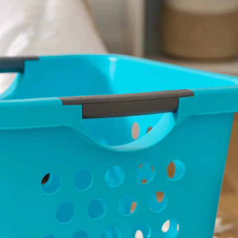 Close-up of teal laundry basket handle with ventilation holes, part of Deep 30L Laundry Basket Hamper Organizer With Built In Comfort Carry Handles So Handy Ventilated Nestable Design 2 Pack Medium Teal Ideal For Closet Dorm Laundry Room And Bedroom Storage