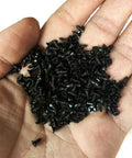 Sweet Little Flathead Phillips Wood Screws With Antiqued Black Finish For No Sweat Assembly On Lumber Garden Gear And Diy Crafts Comes Ready With One Hundred Pieces, held in a hand.