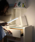 Stick On LED Closet Lights With Motion Sensor, 21 High Brightness LEDs, woman using light on bedside table, 6000K cool white