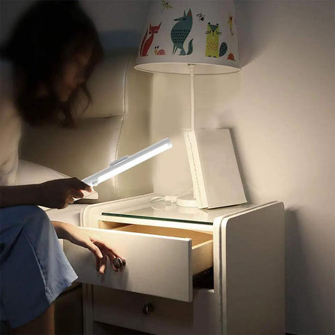 Stick On LED Closet Lights With Motion Sensor, 21 High Brightness LEDs, woman using light on bedside table, 6000K cool white