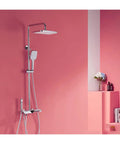 RIBEUJIZS Digital Shower System with sleek silver finish, featuring overhead and handheld shower options against a pink wall.