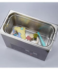 Industrial Ultrasonic Cleaner With Digital Display And Six Liter Tank containing cleaning toys in a stainless steel basket.