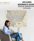 Woman using laptop with Boardroom Series USA Wall Map Dope Antique Style Laminated Poster for Home Office visible on wall
