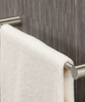 Align 24-Inch Modern Single Towel Bar In Brushed Nickel For Bathroom Or Kitchen installed with a white towel hanging