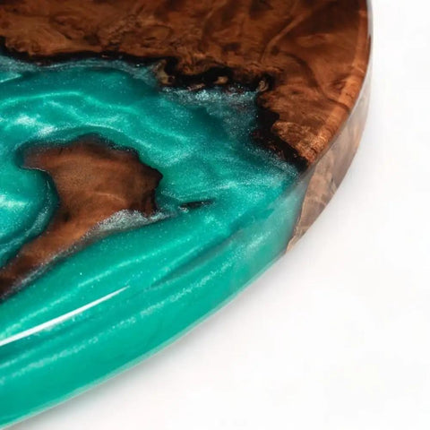 Close-up of 16 Inch Turquoise Epoxy Resin Lazy Susan Wood Turntable Organizer showcasing turquoise and wood texture.
