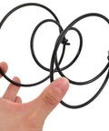 Rock Solid Heavy Duty Tension Springs 4 Pack Sofa Replacement Parts Fix Couch And Recliner Fast High Strength Steel Clip Kit For Bed Frame Repair Built Tough 3.93 Inch Super Durable Support Boost, black steel springs in hand.