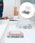 Heavy Duty 141 Piece Black Hex Socket Screw Kit With Matching Nuts And Furniture Fasteners For Crib Bed Frame Repair displayed with a drill.