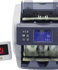 Built Tough Multi Currency Money Counter Machine With Cis Bill Validation And Auto Serial Number Detection Features Lcd Display Built In Printer And Multiple Counting Modes For No Sweat Stacking Operations, showing LCD and cash in motion.