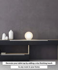 Rondo Round Table Lamp with glass ball shade on modern console, 8 inch white frosted opal globe light in living space.