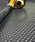 Diamond Plate Rubber Flooring Roll 3 Mm Thick 4 Ft By 3 Ft Black Heavy Duty Floor Mat showing diamond texture with tool on top
