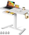 Flex Your Workspace Routine With This Slick Rollaway Standing Desk Featuring A Roomy Desktop Pull Out Storage Bin Built In Mug Holder Heavy Duty Side Hooks And Easy Glide Wheels, showcasing a white ergonomic desk with storage.