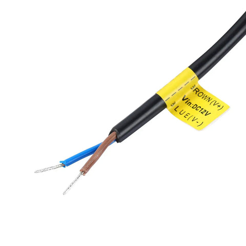 Close-up of a DC 12V wire with labeled terminals for Two Pack DC 12V LED Flood Lights 50W 4500 Lumens 6500K Daylight White Outdoor Security Flood Lamps IP65 Waterproof For Patio Deck Garage Car Boat Use Anywhere You Need