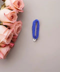 Dual Pack Pro Gear Electric Epee Wire Replacement Set For Fencing, Low Resistance Stainless Wire next to pink roses