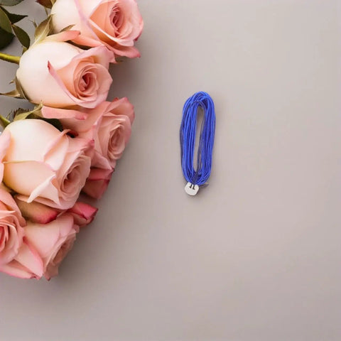 Dual Pack Pro Gear Electric Epee Wire Replacement Set For Fencing, Low Resistance Stainless Wire next to pink roses