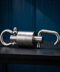 Heavy Duty Stainless Steel Swivel Rotation Joint Goes Like Butter For Dockside Hoists Workshop Rigs And Nautical Gear No Sweat Rust Proof Connector Fits Size Two Tubing on black surface.