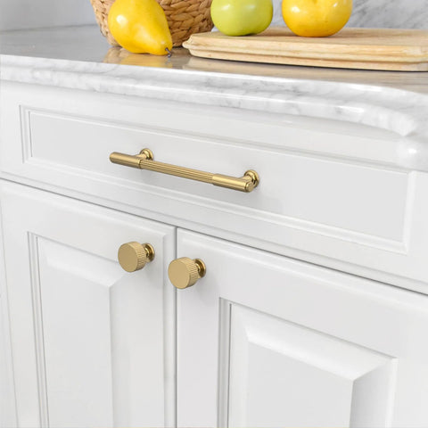 10 Pack Champagne Bronze Cabinet Pulls 5 Inch Center To Center installed on white kitchen cabinets with smooth edges
