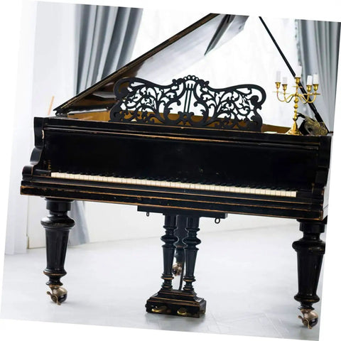 Smooth Riding Vintage Brass Plate Casters Four Pack For Furniture Wheels Featuring Sturdy Ball Bearings And Hardwood Safe Non Marking Rollers Heavy Duty Rustic Hardware Upgrade Set on a vintage grand piano with ornate details.